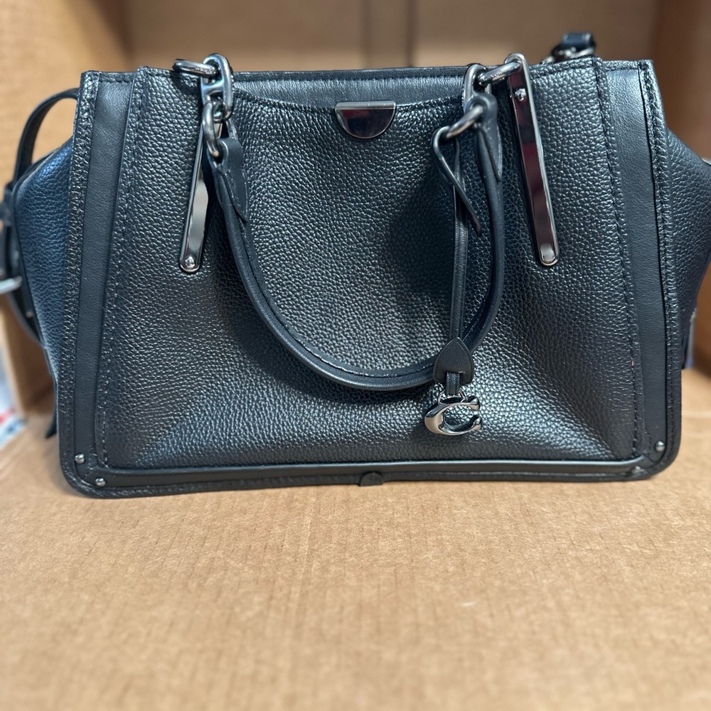 Coach dreamer 27in pebbled black leather with pewter hardware.
